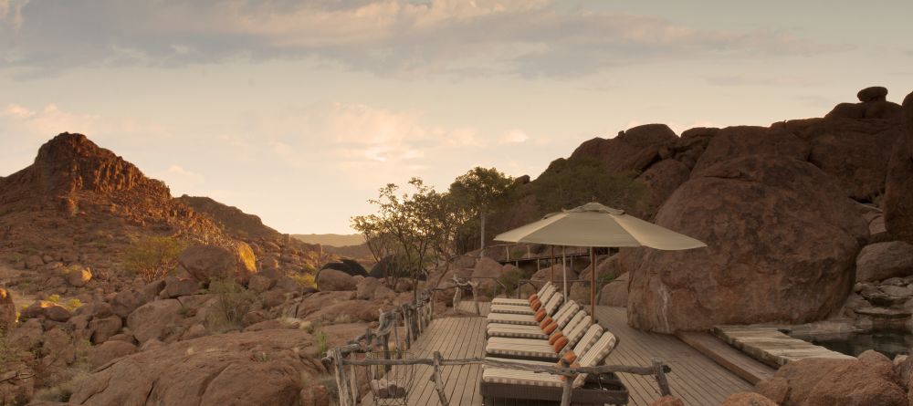 The veranda with pool and sunloungers at Mowani Mountain Camp, Damaraland, Namibia - Image 5
