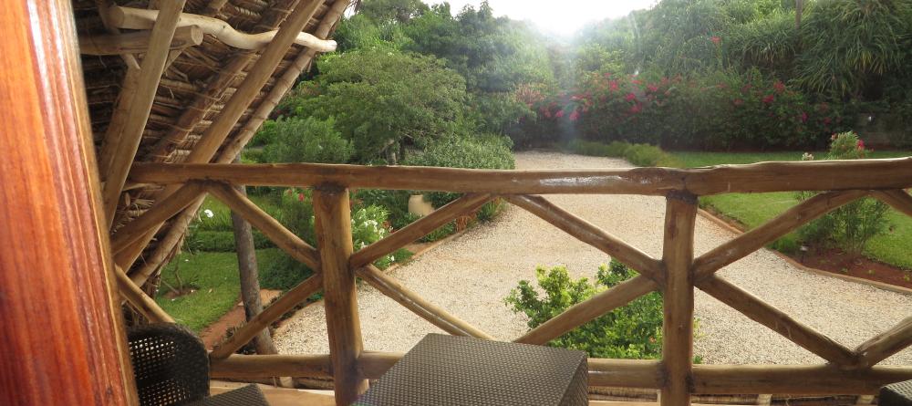 The garden veranda overlooks the lush foliage and manicured lawns at Villa Turquoise, Zanzibar, Tanzania (Mango staff photo) - Image 8