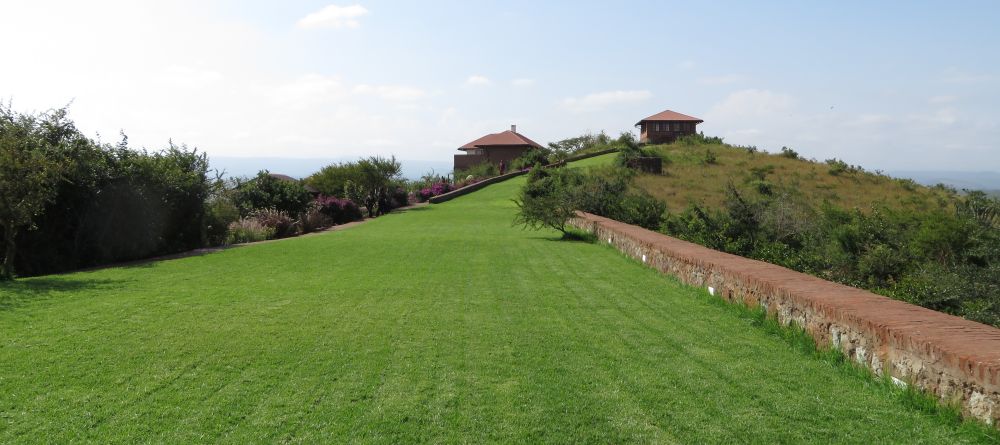 The sweeping manicured lawn extends up towards the main building at Bashay Rift Lodge, Karatu, Tanzania (Mango staff photo) - Image 8