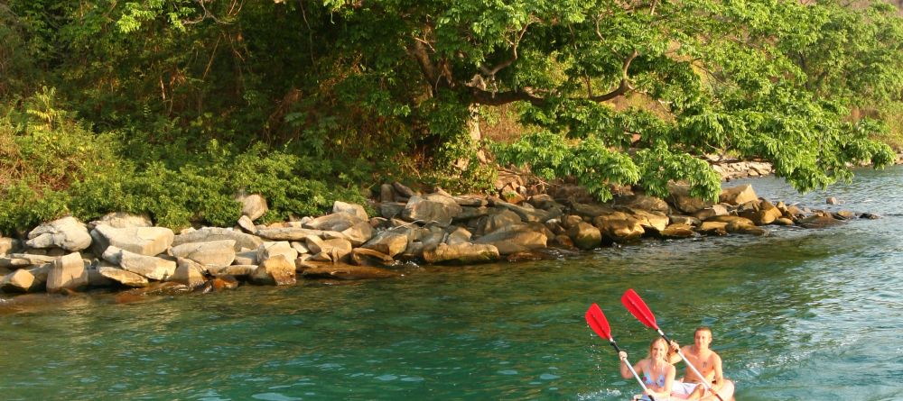 Exploring the coastline in kayaks at Kungwe Beach Lodge, Mahale Mountains National Park, Tanzania - Image 11