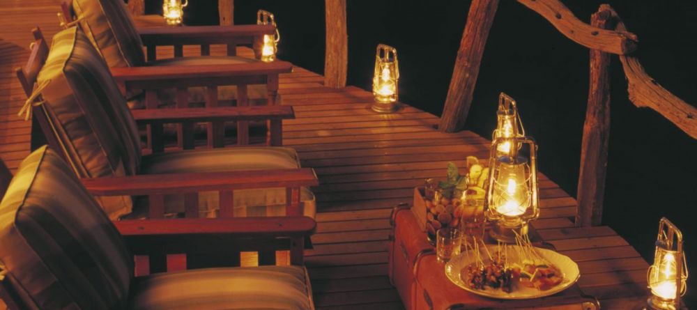 The veranda is perfect relaxation during day and night at Kwandwe River Lodge, Kwandwe Private Game Reserve, South Africa - Image 6