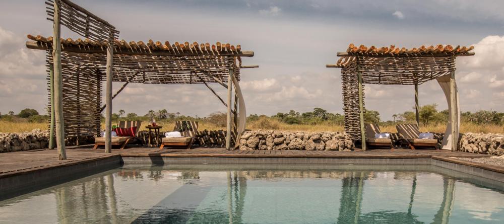 Soak up sun by the pool overlooking the nearby wildlife at Chem Chem Lodge, Lake Manyara National Park, Tanzania - Image 19