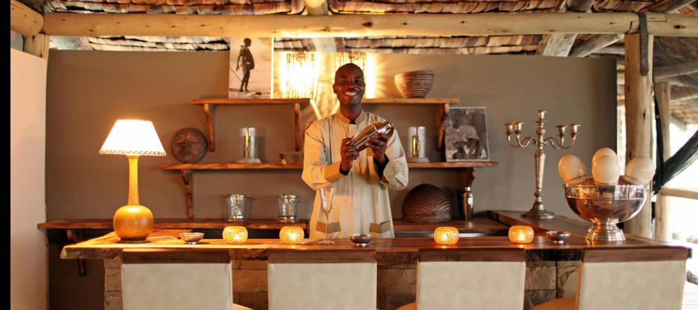 Indulge in a cocktail while watching the sunset in a blaze of pinks and oranges at Chem Chem Lodge, Lake Manyara National Park, Tanzania - Image 14