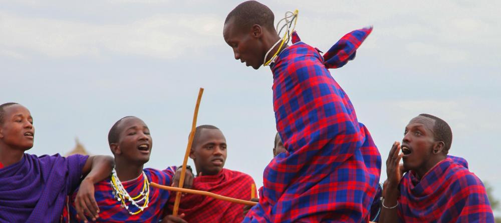 Masai tribesmen engage in a traditional jumping dance at Chem Chem Lodge, Lake Manyara National Park, Tanzania - Image 3