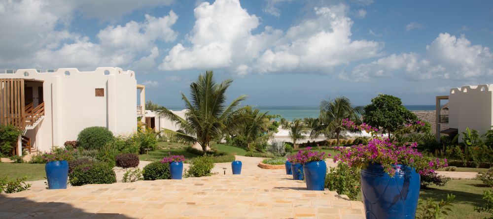 The flower-dotted grounds overlooking the turquoise waters at Gold Zanzibar Beach House & Spa, Zanzibar, Tanzania  - Image 20