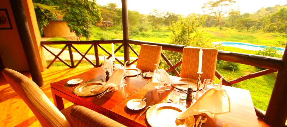 The dining area overlooks the pool and lush surroundings at The Emakoko, Nairobi National Park, Nairobi, Kenya - Image 11