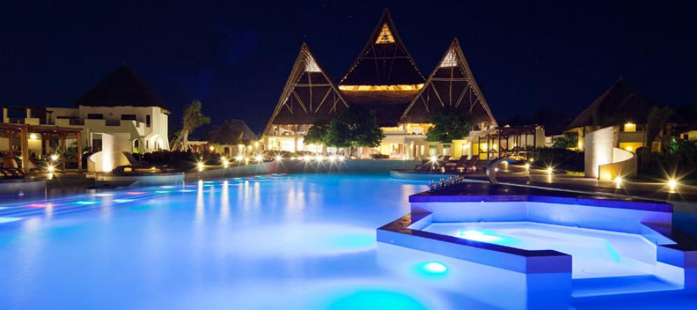 The pool illuminated at night at Essque Zalu Zanzibar, Zanzibar, Tanzania - Image 1
