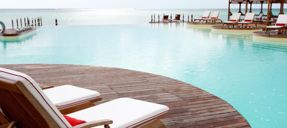 The infinity pool blends seamlessly with the Indian Ocean on the horizon at Essque Zalu Zanzibar, Zanzibar, Tanzania - Image 19