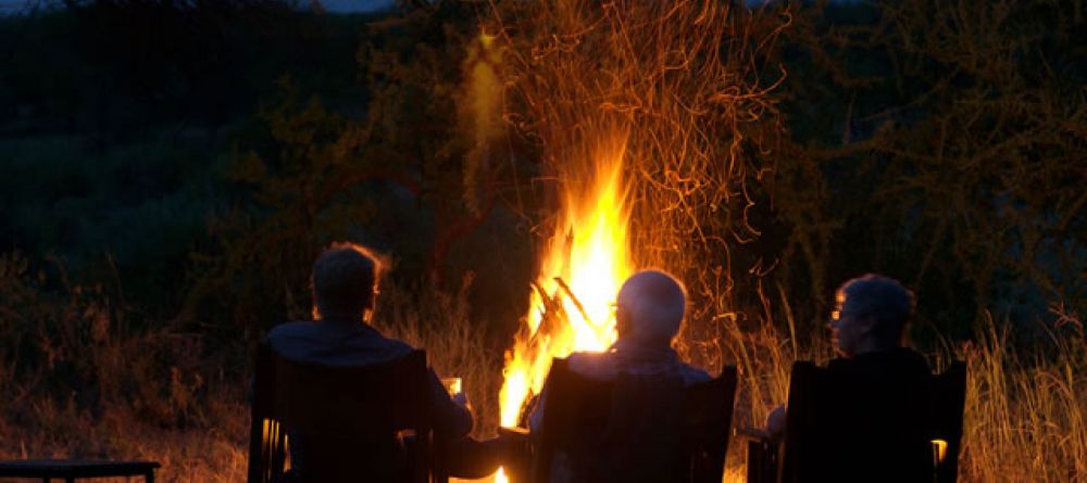 Regaling guests by the fire - Image 2