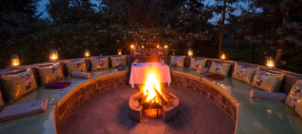 Fire pit at night at Amakoro Songa Lodge - Image 3