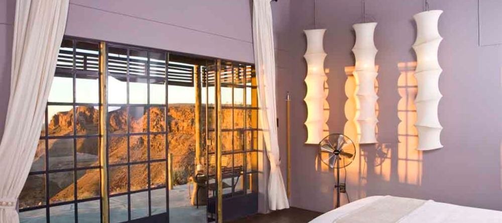Fish River Canyon Lodge - Bedroom, Patio and Landscape View - Image 7