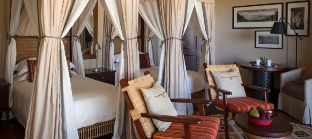 A luxury twin bedroom at The Four Seasons Safari Lodge, Serengeti National Park, Tanzania - Image 11