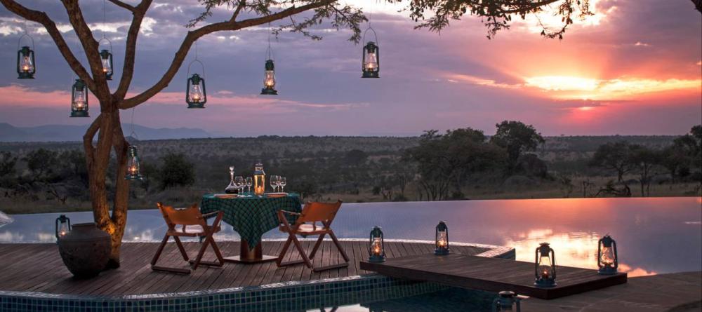 Share a private romantic dinner as the sun sets over the plains at The Four Seasons Safari Lodge, Serengeti National Park, Tanzania - Image 21