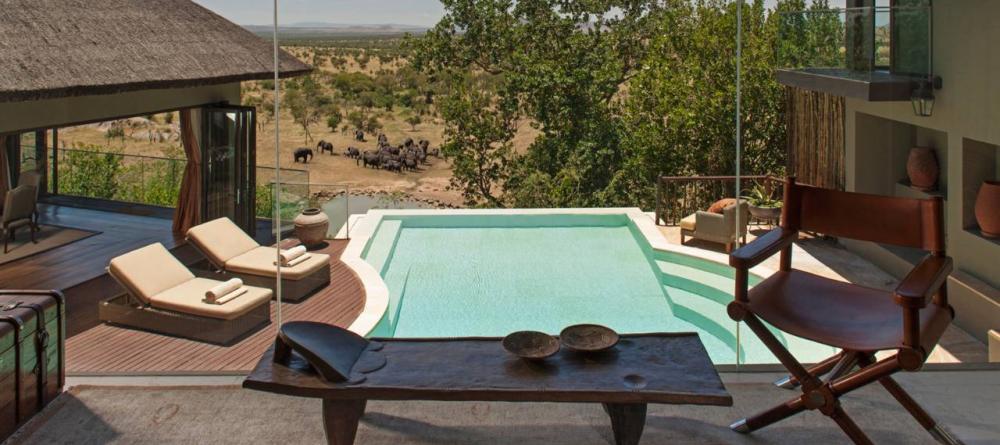Lounge by a private pool overlooking a herd of elephants at the watering hole at The Four Seasons Safari Lodge, Serengeti National Park, Tanzania - Image 19