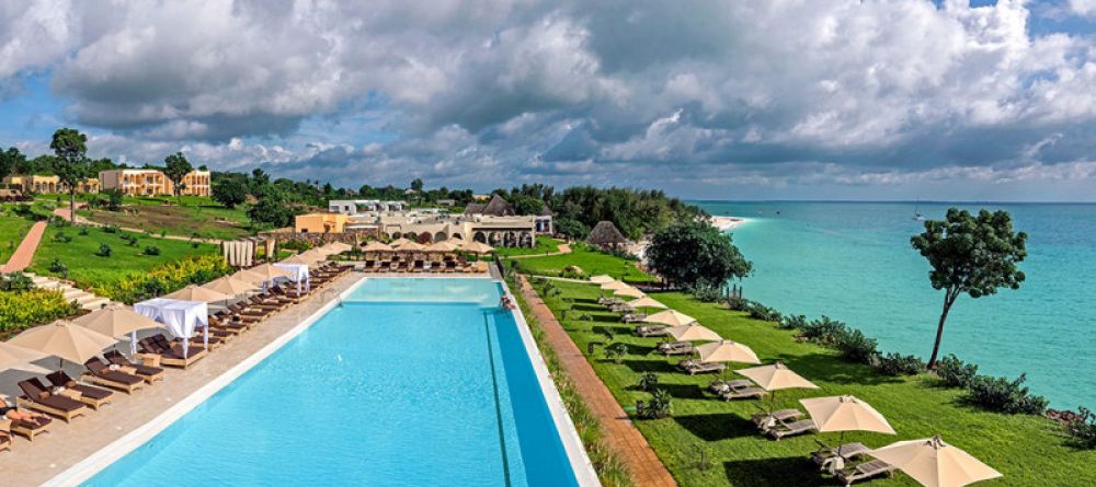 Lounge in the sun by the beautiful pool at Hideaway of Nungwi Resort & Spa, Zanzibar, Tanzania - Image 6
