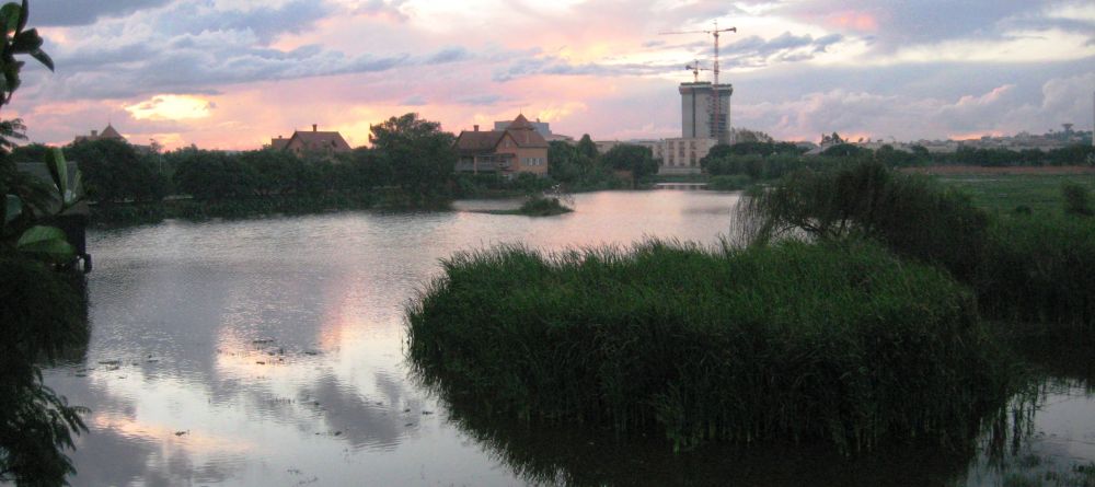 The sunset over the nearby waterway at Tamboho Hotel, Antananarivo, Madagascar (Mango Staff photo) - Image 6