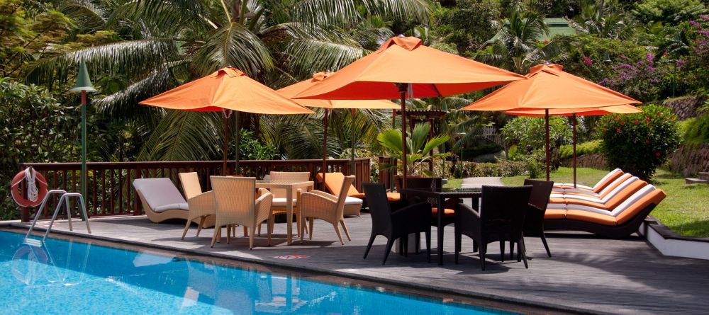 The pool and sun loungers at Hotel L Archipel, Praslin, Seychelles - Image 1