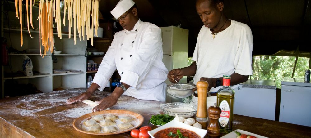 The chef team prepares fresh pasta and a sauce made from scratch at Offbeat Mara Camp, Masai Mara National Reserve, Kenya - Image 6