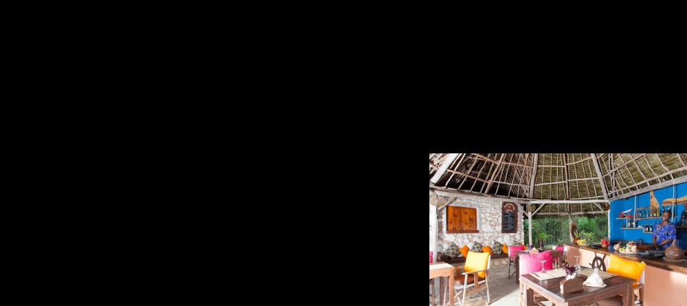Enjoy a meal in the colorful, open air dining area at Kasha Boutique Hotel, Zanzibar, Tanzania - Image 5