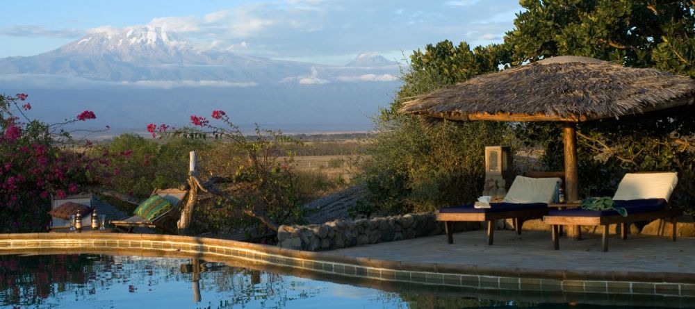 The pool with sun loungers for relaxation at KIA Lodge, Arusha, Tanzania - Image 4