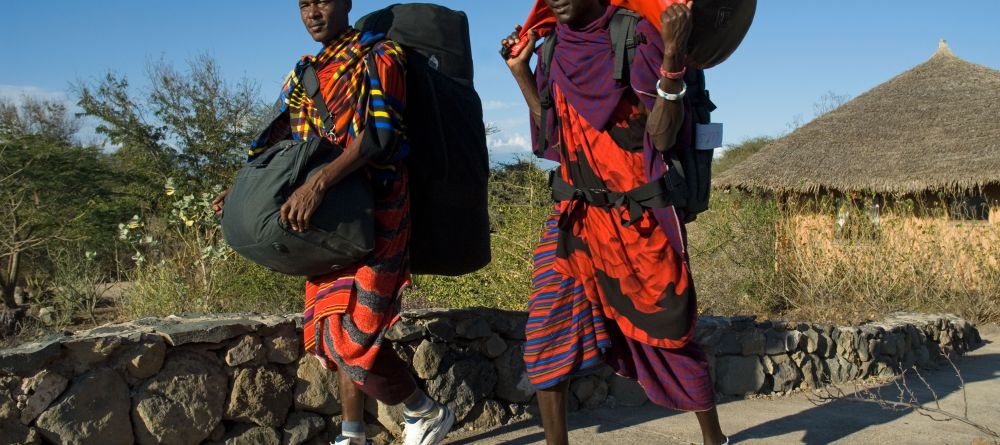 The friendly staff carrying guest bags to their rooms at KIA Lodge, Arusha, Tanzania - Image 8