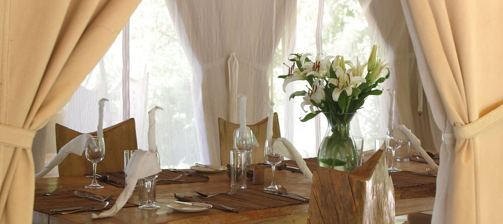 An elegant table setting in the dining area at Naibor Camp, Masai Mara National Reserve, Kenya - Image 20