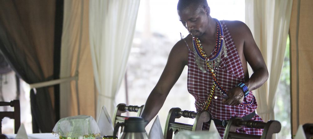Setting the dining area at Ngare Serian Camp, Masai Mara National Reserve, Kenya - Image 5