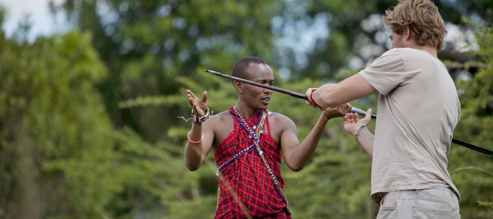 Learning to throw a spear from the Maasai tribesmen at Ngare Serian Camp, Masai Mara National Reserve, Kenya - Image 6