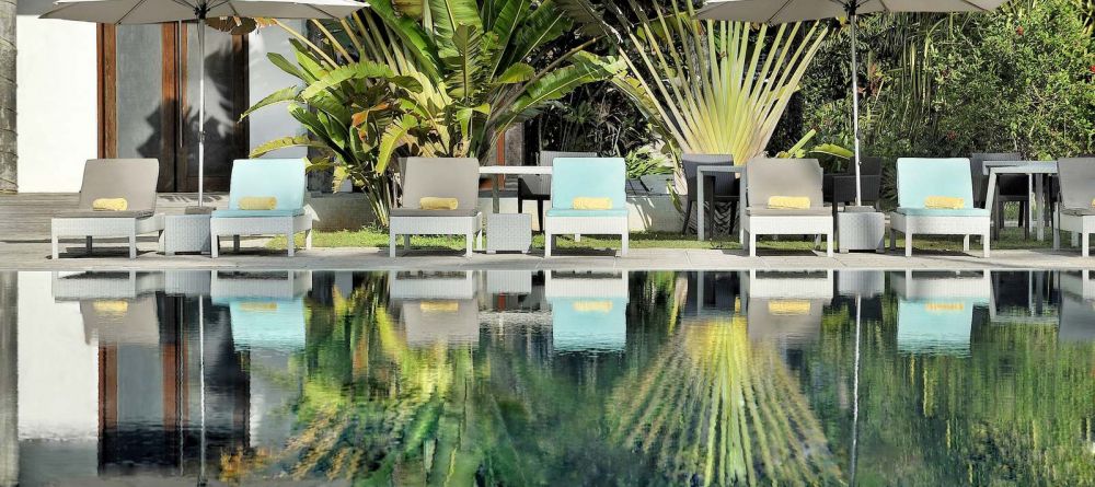 Sun loungers by the pool at Le Meridien Barbarons, Mahe, Seychelles - Image 9