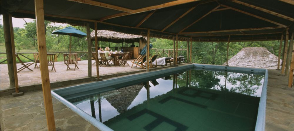 Pool with dining area behind at Sable Mountain Lodge, Selous National Park, Tanzania - Image 9