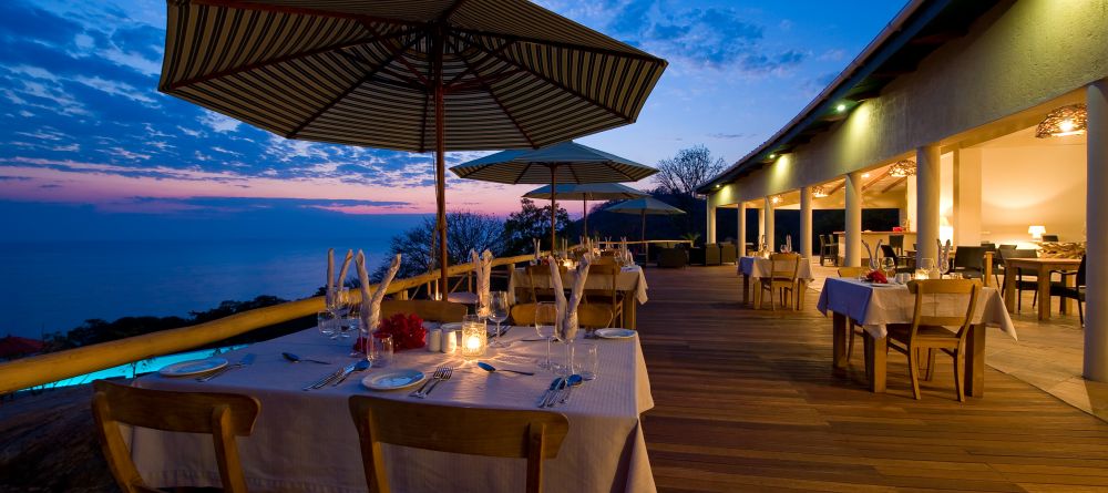 Outdoor dining in the evening at Pumulani, Lake Malawi, Malawi - Image 2