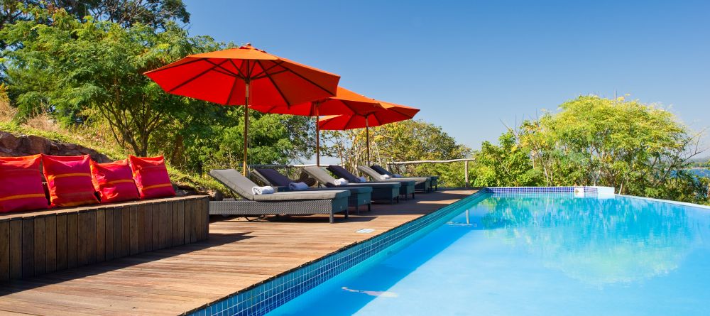 Enjoy the sun by the pool at Pumulani, Lake Malawi, Malawi - Image 3