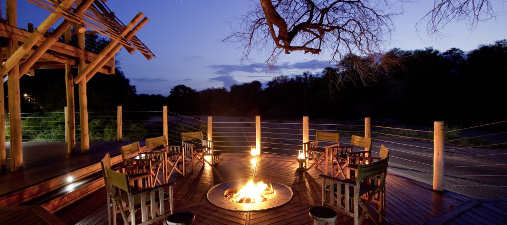 Rhino Post Safari Lodge - Deck in the Evening - Image 14