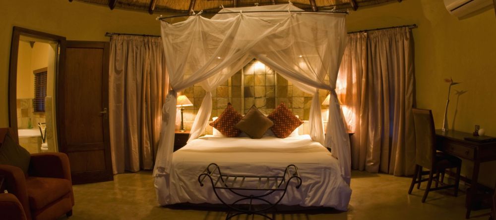 Rondavel bedroom at Elephant Plains Game Lodge, Sabi Sands Game Reserve, South Africa - Image 4