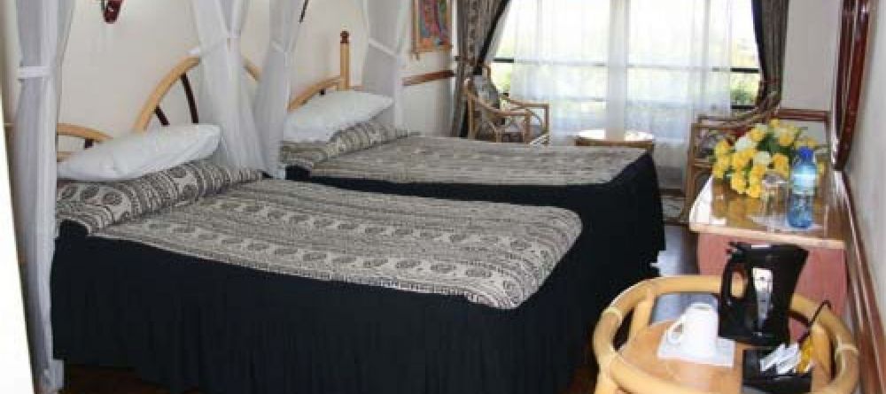 Guest room at Impala Hotel - Image 1