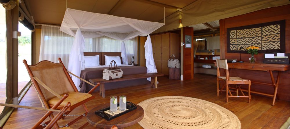 The luxurious bedroom with elements of African and Victorian-inspired decor at Serengeti Bushtops Camp, Serengeti National Park, Tanzania - Image 6