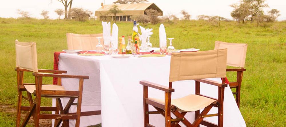 Dine al fresco with the sounds of the savannah around you at Serengeti Savannah Camps, Serengeti National Park, Tanzania - Image 6