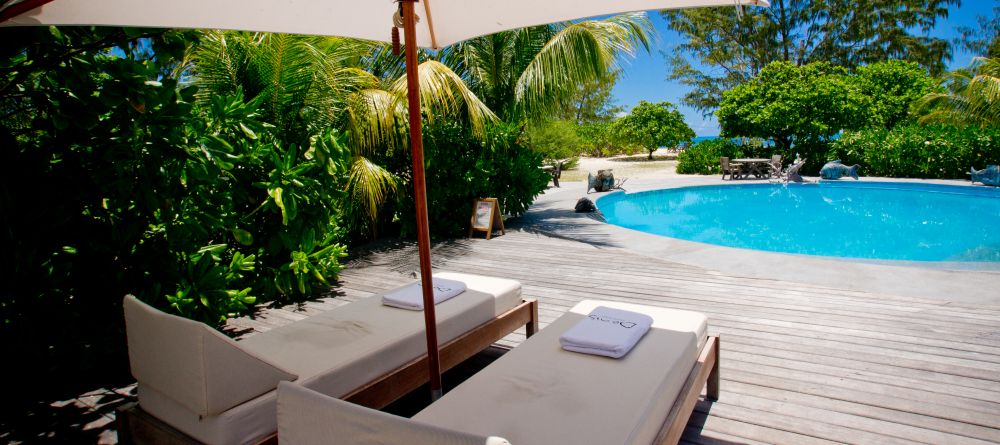 Sun loungers by the pool at Denis Island Lodge, Denis Island, Seychelles - Image 6