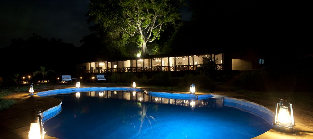The pool illuminated at night at The Emakoko, Nairobi National Park, Nairobi, Kenya - Image 12