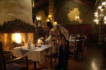 Dinner by the fireplace at Ngorongoro Serena Lodge, Ngorongoro Crater, Tanzania