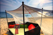Romantic relaxation on the beach at Kungwe Beach Lodge, Mahale Mountains National Park, Tanzania