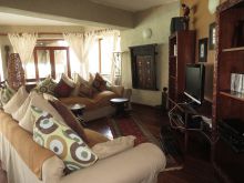 Take a break from the sunshine in the comfortable lounge complete with a library collection at Zi Villa Zanzibar, Matemwe, Zanzibar, Tanzania (Mango staff photo)