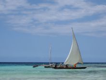 A traditional dhow sails by on the jade waters at The Residence Zanzibar, Zanzibar, Tanzania (Mango staff photo)