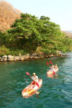 Exploring the coastline in kayaks at Kungwe Beach Lodge, Mahale Mountains National Park, Tanzania