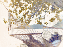 Romantic relaxation in a hammock at Raffles Praslin, Praslin, Seychelles