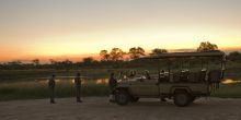 Enjoying sundowners during sunset at Rhino Post Safari Lodge, Kruger National Park, South Africa