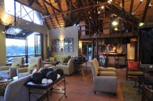 A Photo of the Lounge at Night at Lukimbi Safari Lodge