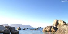 Swimmers enjoy the calm turquoise waters at Boulders Beach, Cape Town, South Africa