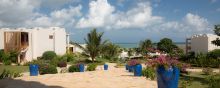 The flower-dotted grounds overlooking the turquoise waters at Gold Zanzibar Beach House & Spa, Zanzibar, Tanzania 