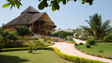 Manicured lawns and lush tropical gardens intermingle at Gold Zanzibar Beach House & Spa, Zanzibar, Tanzania 
